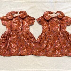 Kate Quinn Floral Twin Set Apron Dresses in Orange and Pink